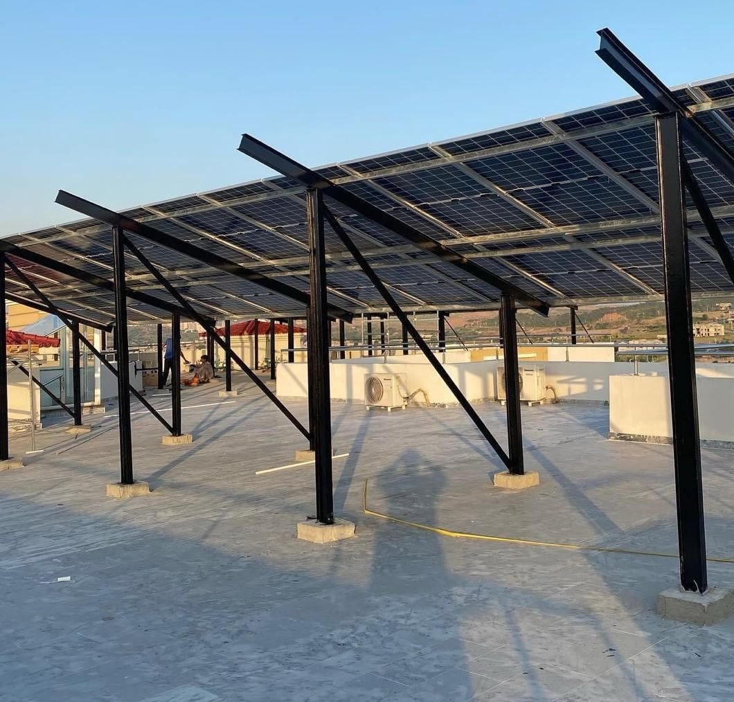 Rooftop solar panel installation by SNM Solutions in Lahore