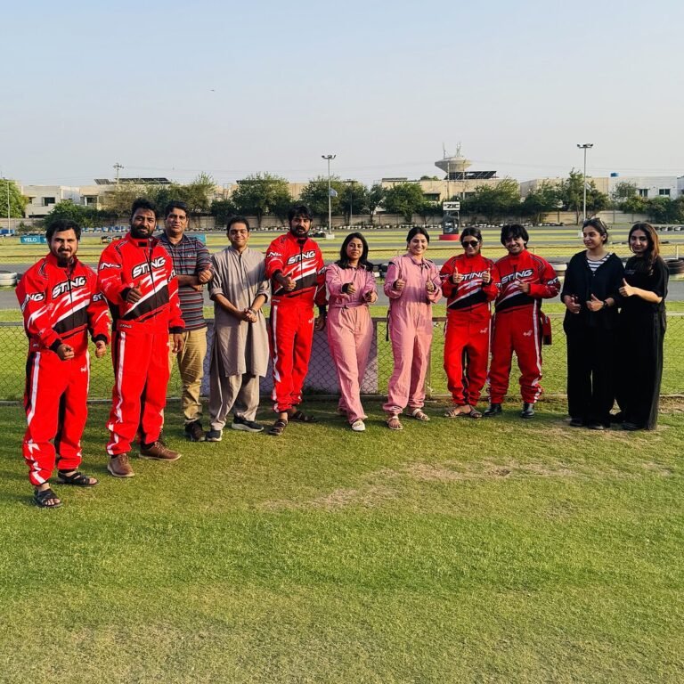 SNM Solutions team and crew on a go-karting team day in Lahore