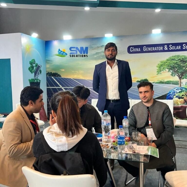 SNM Solutions team meeting visitors at the exhibition booth