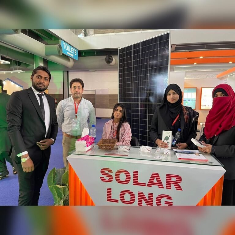 SNM Solutions team at a solar panel stand at an exhibition